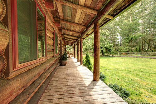 The porch of a rural log cabin